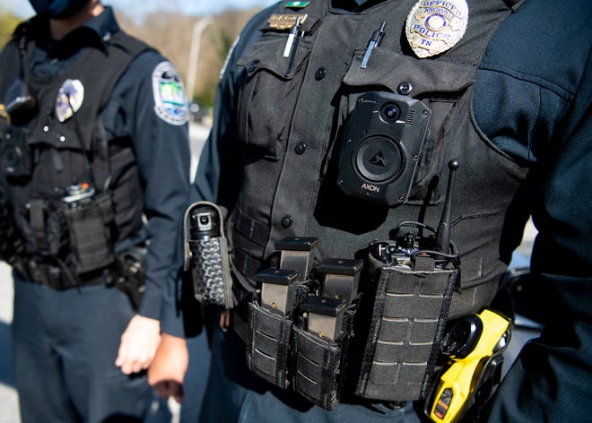 Knoxville police officers wear the new Axon body-worn cameras now used by KPD during a demonstration held at KPD's headquarters in downtown Knoxville on Thursday, April 1, 2021. KPD issued out 297 body-worn cameras and installed 333 in-car systems.