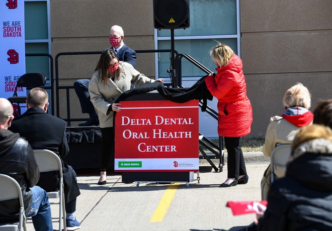 The name is revealed for the Delta Dental Oral Health Center before the official groundbreaking of the new School of Health Sciences building on Thursday, April 1, 2021, at the University of South Dakota in Vermillion.