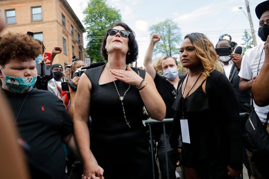 Courteney Ross, center, who had been dating George Floyd, reacts after a memorial service for Floyd at North Central University on Thursday, June 4, 2020, in Minneapolis.