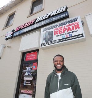 Monte Vales, owner of Speedy iRepair on West Market Street in Wallhaven Friday, April 2, 2021 in Akron, Ohio.