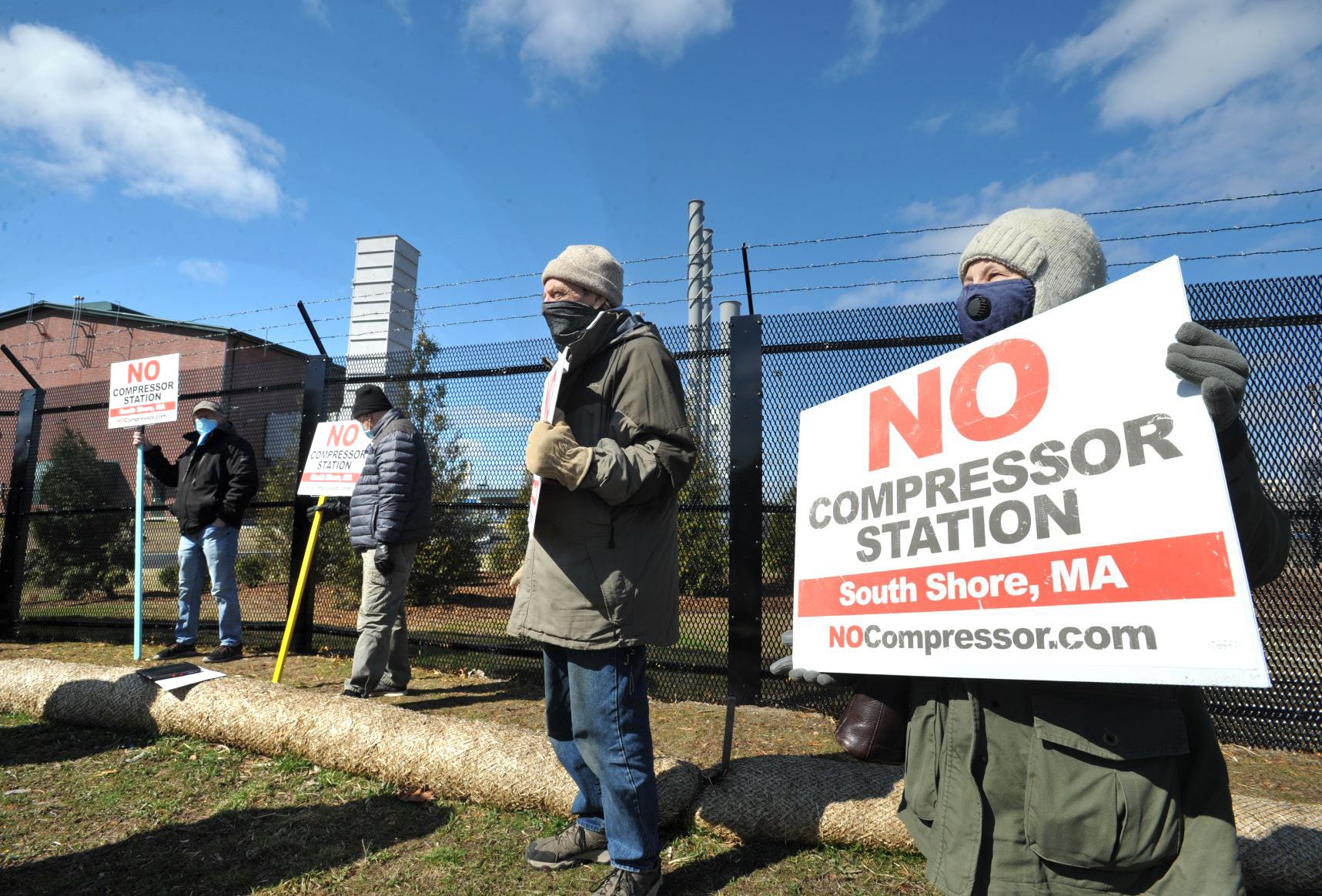 Charles Broggi, of Weymouth, center, and his wife, Ann Broggi, right, express their opposition to the gas compressor station in North Weymouth during a rally with Sen. Edward Markey and local officials on Friday, April 2, 2021.