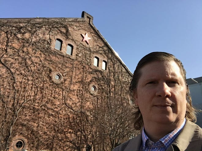 Shawn Clankie is pictured outside of the front of the 19th century Sapporo Beer Brewery warehouse in Sapporo, Hokkaido, Japan.