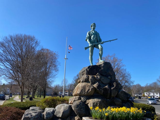 The Lexington Minuteman statue stands at the town green of Lexington, Massachusetts.