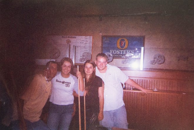 Angela, second from left, poses for a photo with her then-boyfriend, Isaac Steves, left, her brother, Aaron, right, and his then-girlfriend, Carolina Iturburu, at Spectators the night of the crash in 2003. 