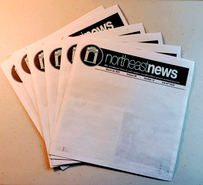 Copies of the March 24, 2021 edition of The Northeast News featuring a blank front page appear in Kansas City, Mo. on March 26, 2021.  The paper chose to leave the front page of their March 24 issue blank to show community members what they'd miss if the newspaper folded. (The Northeast News via AP)