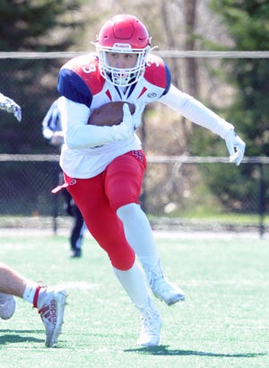 Bridgewater-Raynham running back Jacob Spear carries the football during a game versus Dartmouth on Saturday, April 3, 2021.