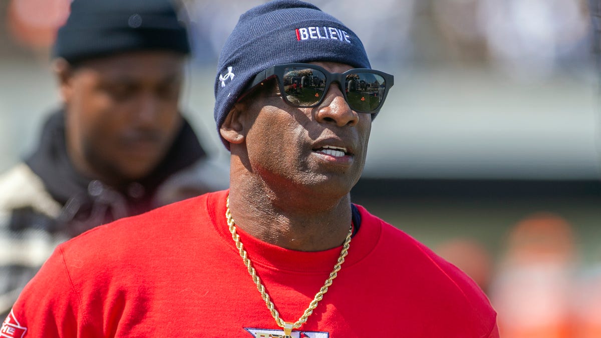 Jackson State University coach Deion Sanders heads into the locker room after pregame warmups with the Tigers before JSU's nonconference battle against longtime rival Southern University at Veterans Memorial Stadium in Jackson, Miss., Saturday, April 3, 2021.