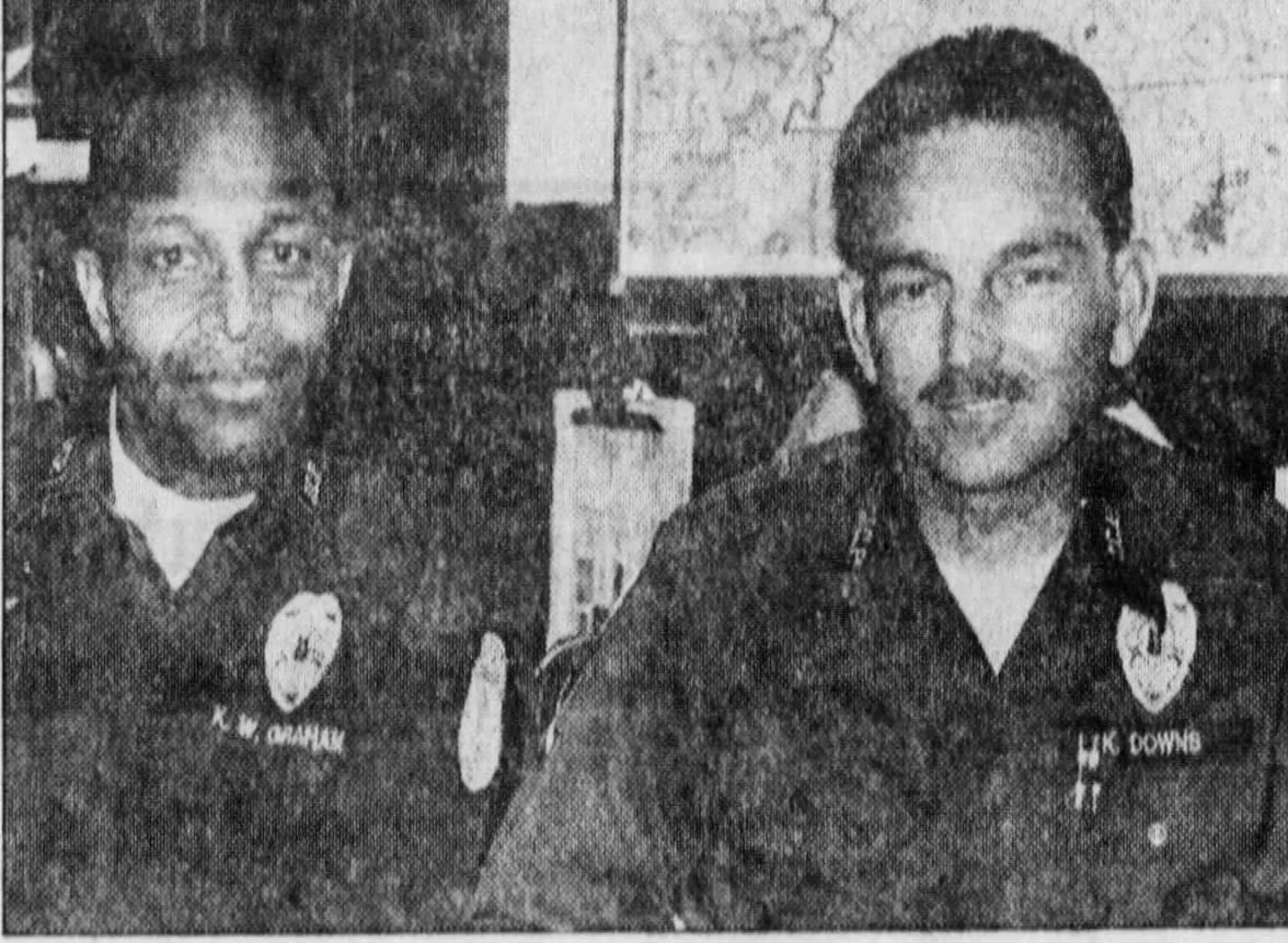 Officer Kenny Downs (right) was with pilot Kenny Graham (seated with him) when they saw the UFO. They described it as a glowing pear-shaped object about the size of a basketball that at one point shot three baseball-size fireballs out of its middle.