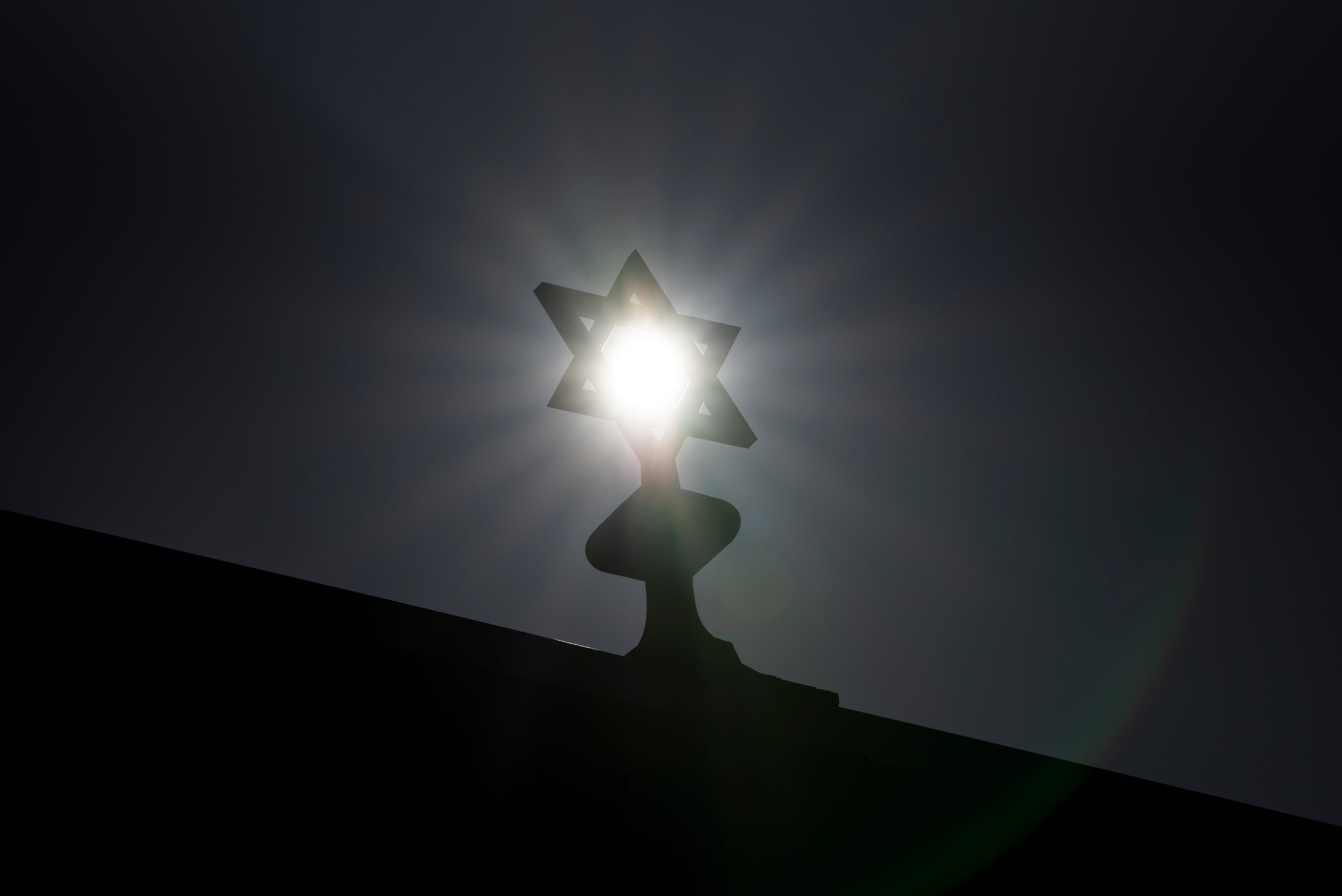 The sun shines through the Star of David on top of the Congregation Ahavas Israel on Van Houten Avenue on Saturday, April 3, 2021.