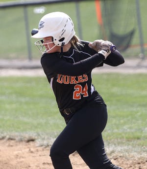 Marlington's Angela Cirone winds up for a swing at a Norton pitch during action at Marlington High School Saturday, April 3, 2021.