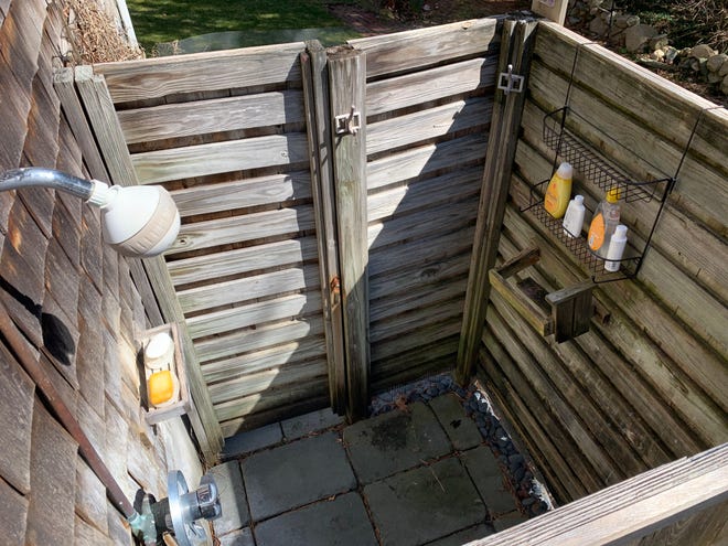 This Cape Cod outdoor shower is all dressed up and ready to go.