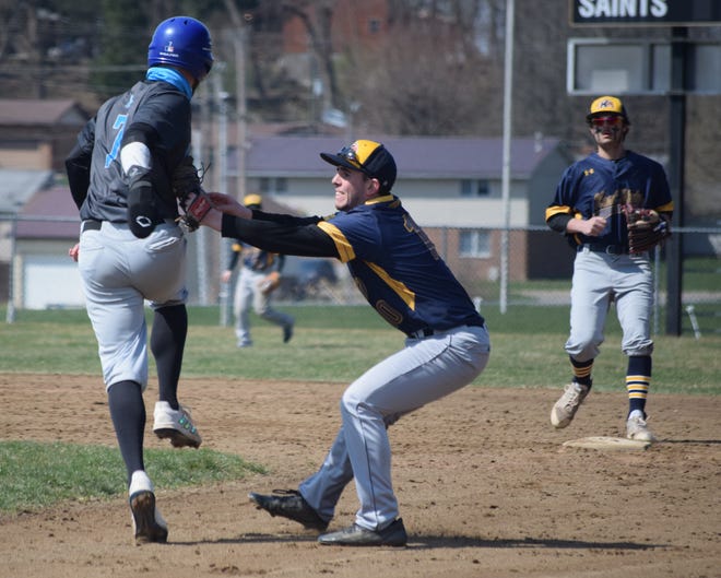 Golden Eagles second baseman Kyle Stotzer tags out an advancing runner before completing the double play.