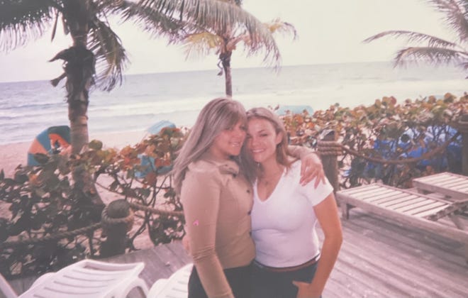 Amy Nolasco, left, and Angela Crowe are pictured in 2001 near the beach.