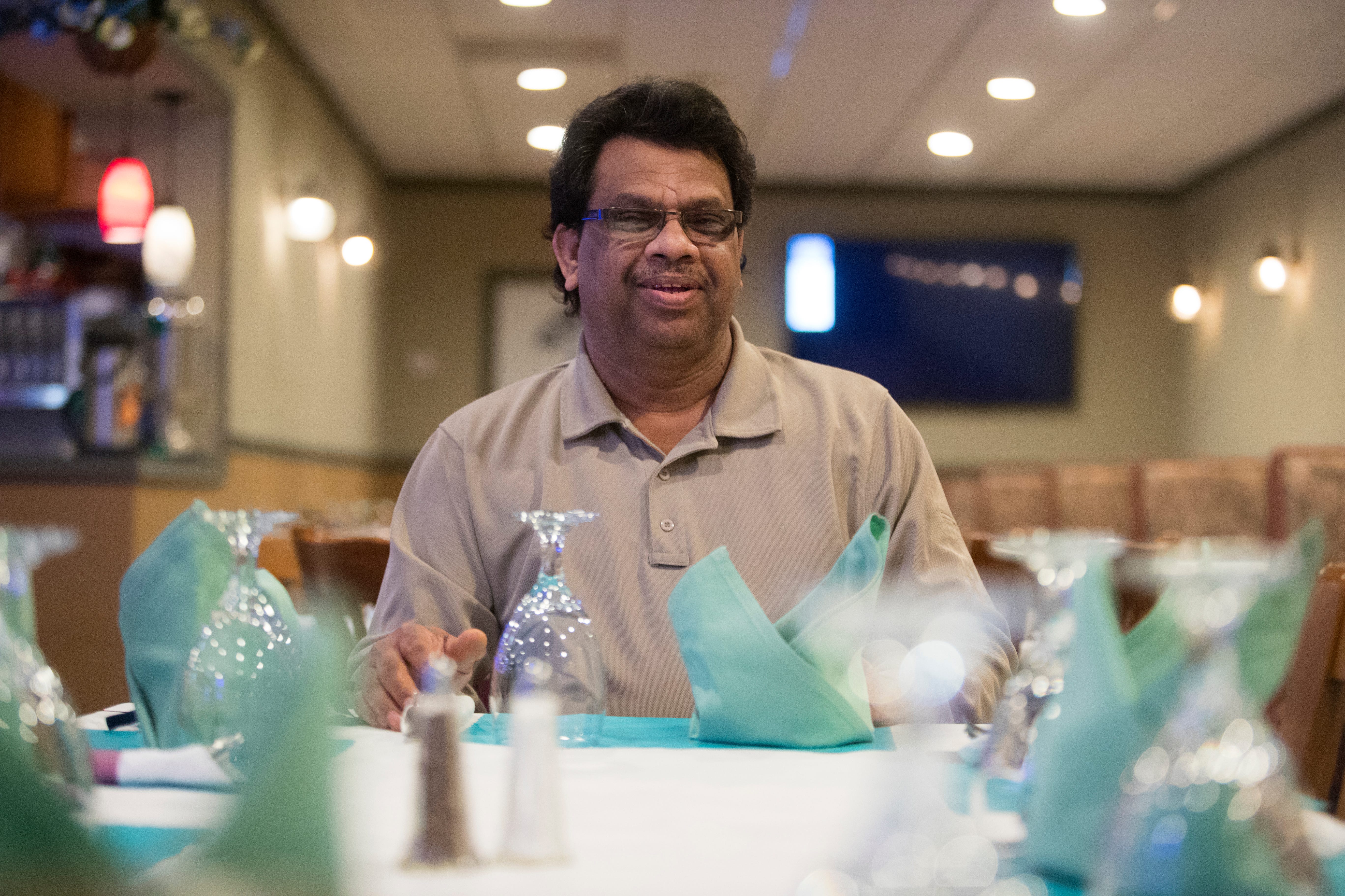 Indian Grille owner Mohammed Elias sits for a portrait at his restaurant Thursday, April 1, 2021. 