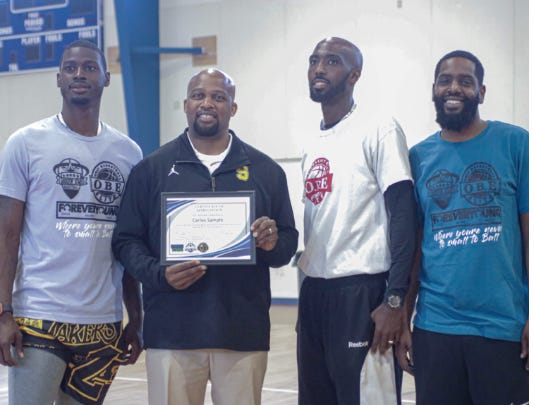 Scotlandville High head coach Carlos Sample, spoke to the kids and provided words of wisdom and encouragement.
