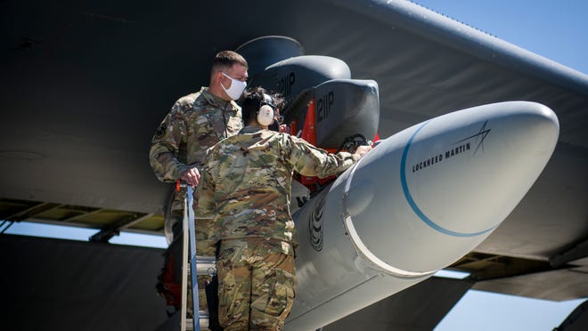 In this August photo, Master Sgt. John Malloy and Staff Sgt. Jacob Puente of the 912th Aircraft Maintenance Squadron at Edwards Air Force Base in California secure the AGM-183A Air-launched Rapid Response Weapon (ARRW) Instrumented Measurement Vehicle 2 to the wing of a B-52H Stratofortress before a "captive carry" test flight. On Monday, the Air Force experienced an unsuccessful test of an ARRW booster vehicle.