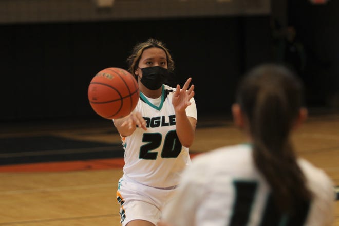 Navajo Prep's Aiona Johnson passes the ball down the right side on Monday, April 5, 2021, at the Eagles Nest in Farmington.