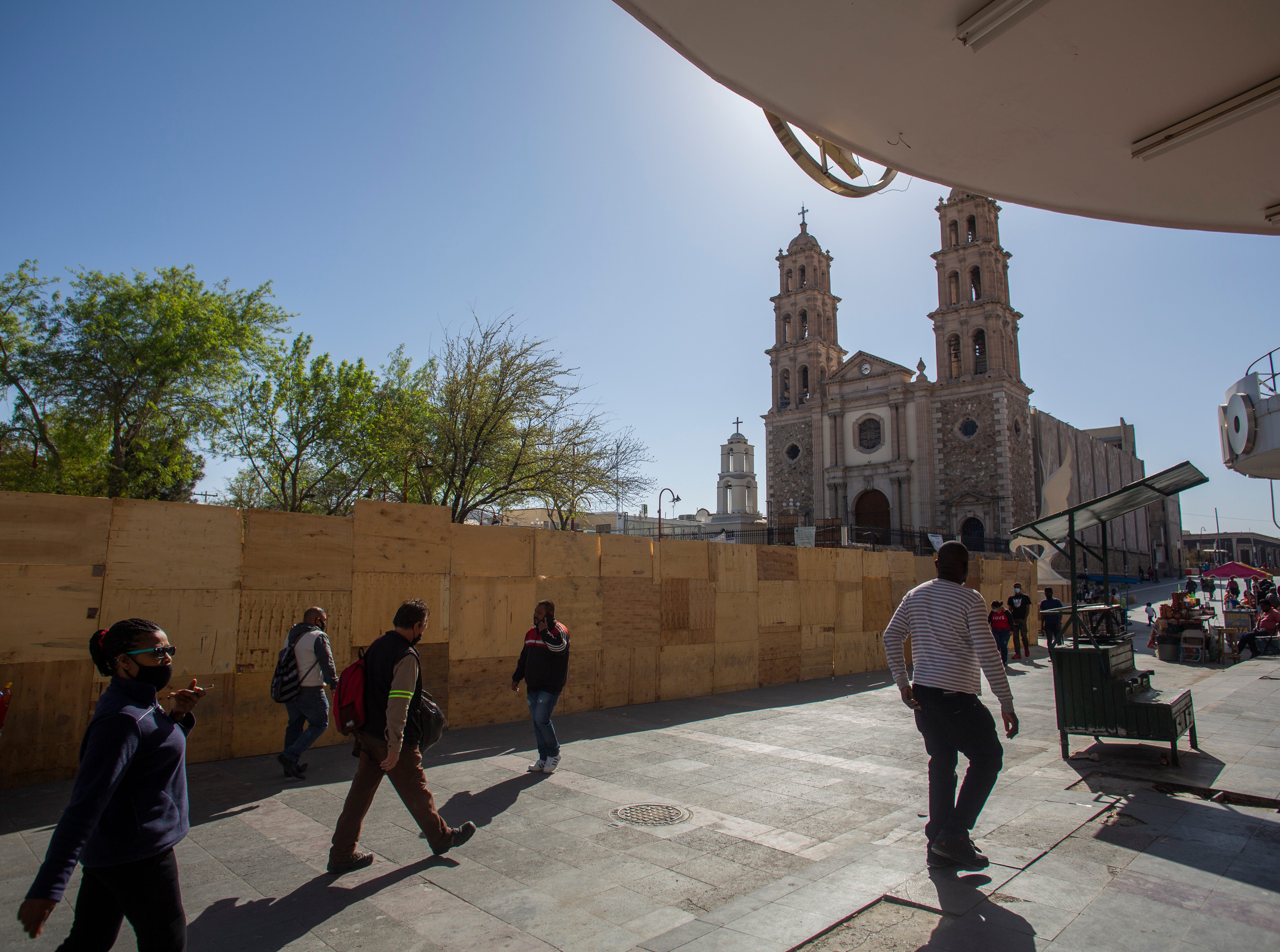 Marie Martine and her husband Fanfan Jean, walk around downtown Ciudad Juarez in search of a belt and shoe laces. U.S. Customs and Border Protection had taken the shoelaces from the migrants when they attempted to enter the U.S. without documentation. 