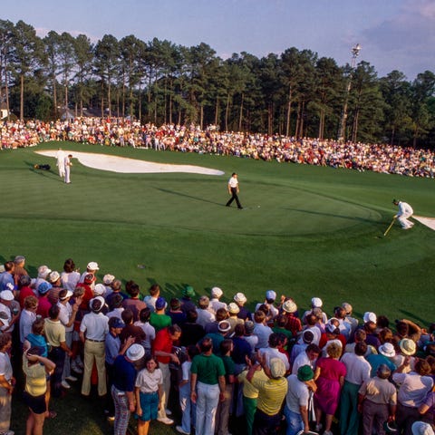 Spectators at the Augusta National Golf Club durin