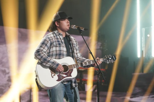 Caleb Kenney plays guitar while performing The Allman Brothers' "Midnight Rider."