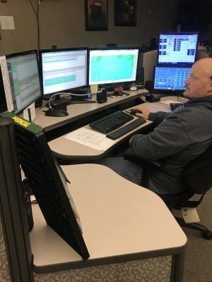 A dispatcher views records and data systems inside Monroe County Central Dispatch off S. Raisinville Rd., where all 911 emergency calls are received.