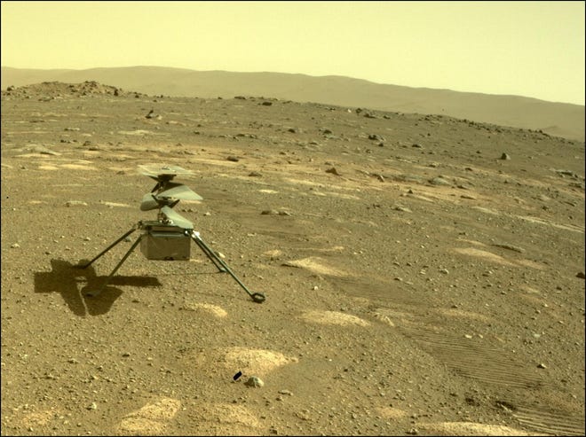 NASA's Ingenuity helicopter can be seen on Mars as viewed by the Perseverance rover's rear Hazard Camera on April 4, 2021.