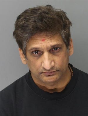 Shaleish Patel, 53, of Canton, following his arrest on criminal sexual conduct charges involving children who attended his temple.