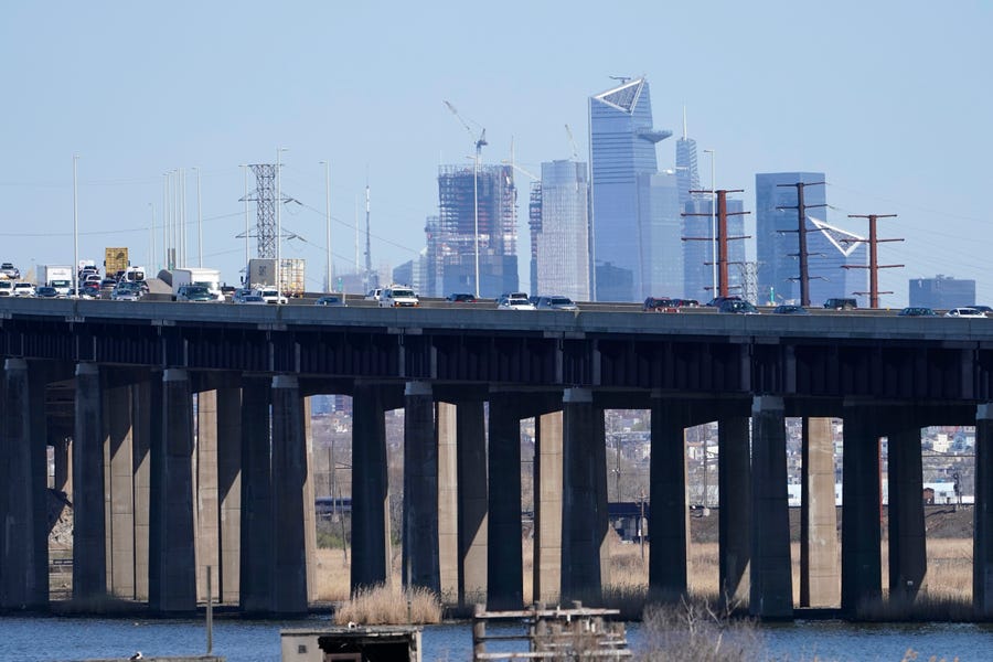 Cars travel on a raised expressway in Kearny, N.J., Tuesday, April 6, 2021. President Joe Biden is setting about convincing America it needs his $2.3 trillion infrastructure plan, deputizing a five-member "jobs Cabinet" to help in the effort.