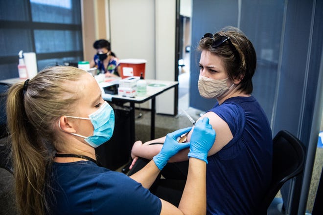 UNC Asheville student Luna Little receives the Johnson and Johnson vaccine in April. Since then, vaccination rates across the state have plummeted, and the new delta variant is driving a fresh surge in COVID-19 cases.