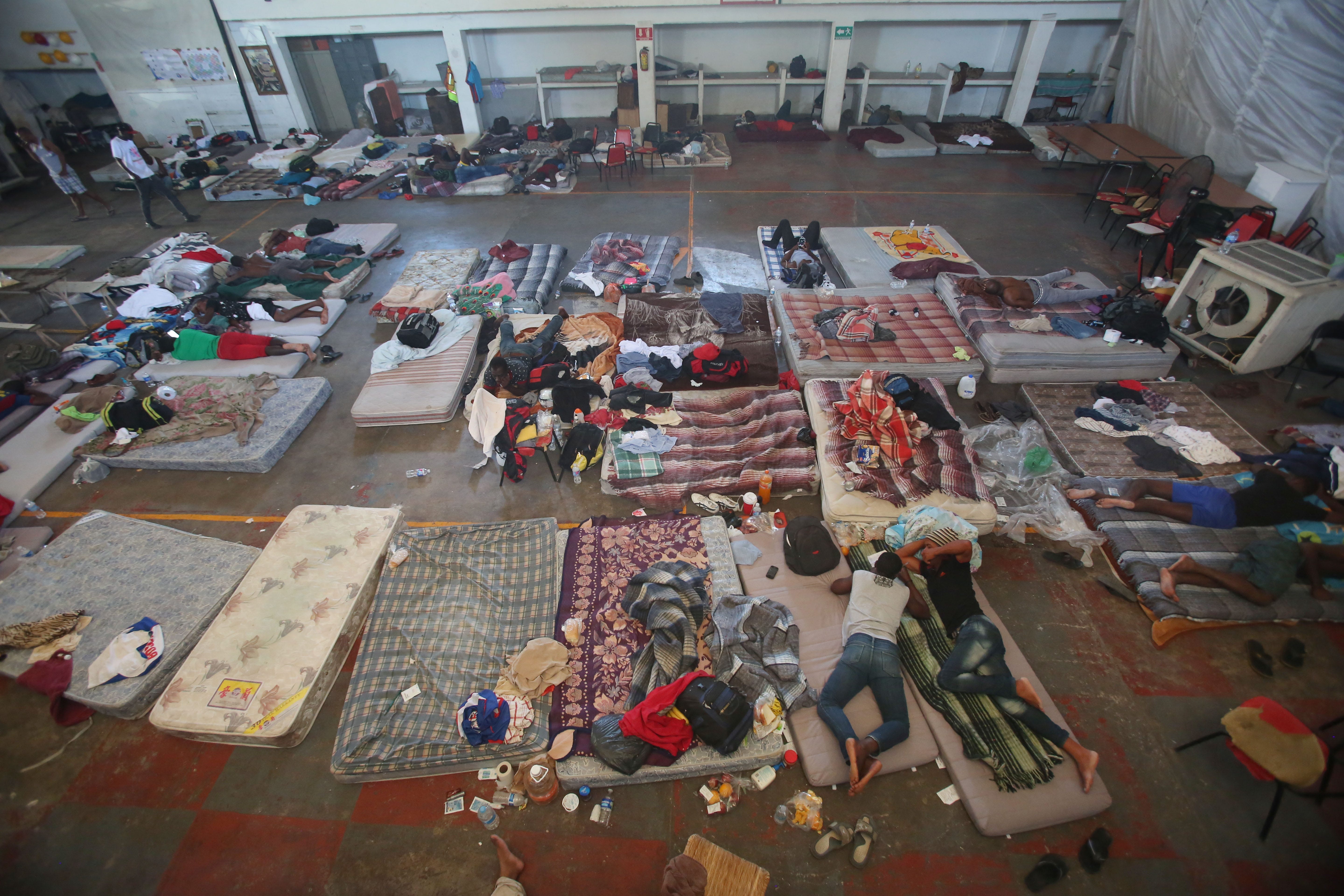 Haitian migrants arrived in the cities of Mexicali and Tijuana, Baja California in 2016. Many of the migrants remained in Tijuana and Mexicali for years, working in the informal economy and in the factories of the border cities. In this photo, Haitian migrants are photographed in a migrant shelter in Mexicali in September of 2016.