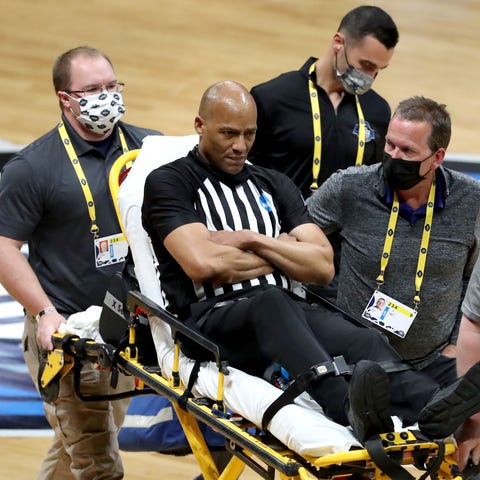 Bert Smith was taken off the court on a stretcher 