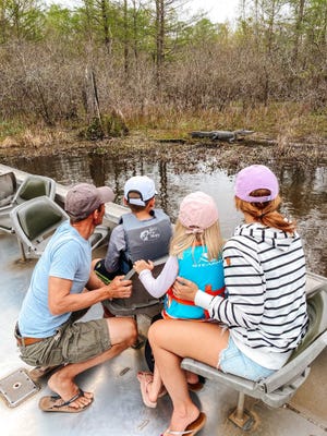 During a swamp tour on Lake Martin in Louisiana, the Walkers saw a lot of wildlife, including an alligator.