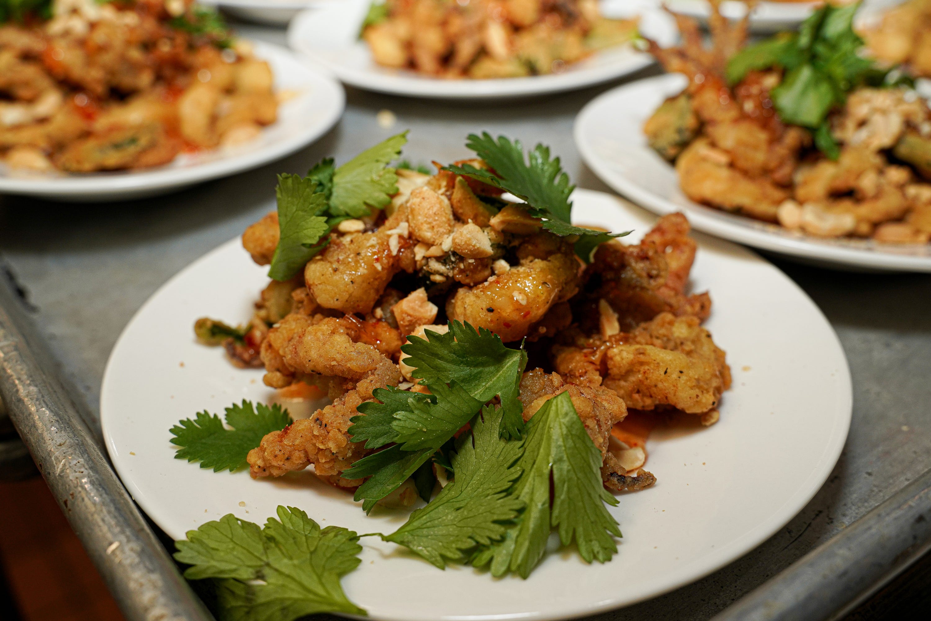 Attendees for the Azalea Festival dinner at Hops Supply Co. got a preview of the Kung Pao Calamari, now on the menu. [STARNEWS FILE PHOTO]