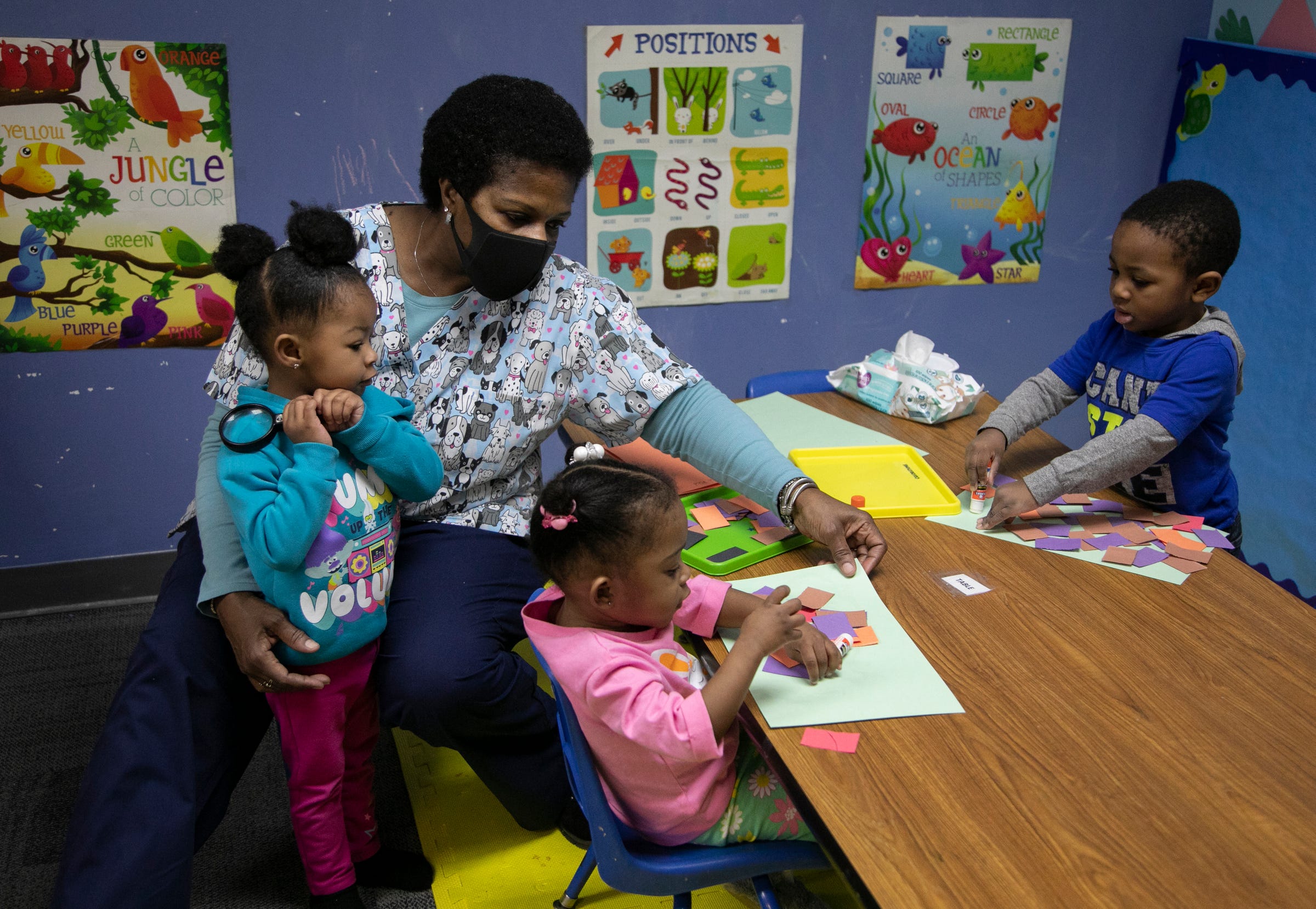 Early start teacher Theresa Copeland wraps up an art project with her students Brailey Hutchinson, 2, left, Aliah Hicks, 2, and Apollo Burton, 2, on Mar. 11, 2021. Franklin Wright Settlements turns 140 this year. The organization is all about helping Detroiters with basic life, social and family needs.