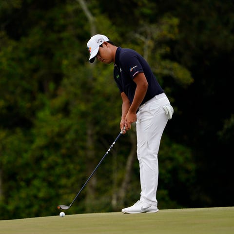Si Woo Kim putts with his 3-wood on the 17th hole 