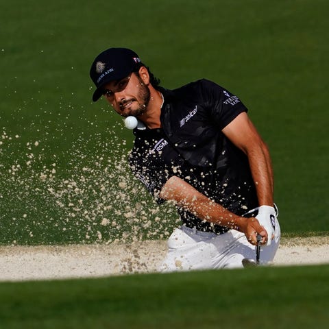 Abraham Ancer hits out of a bunker on the 2nd hole