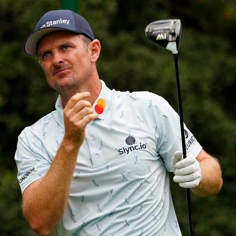 Justin Rose hits his tee shot on the 15th hole dur