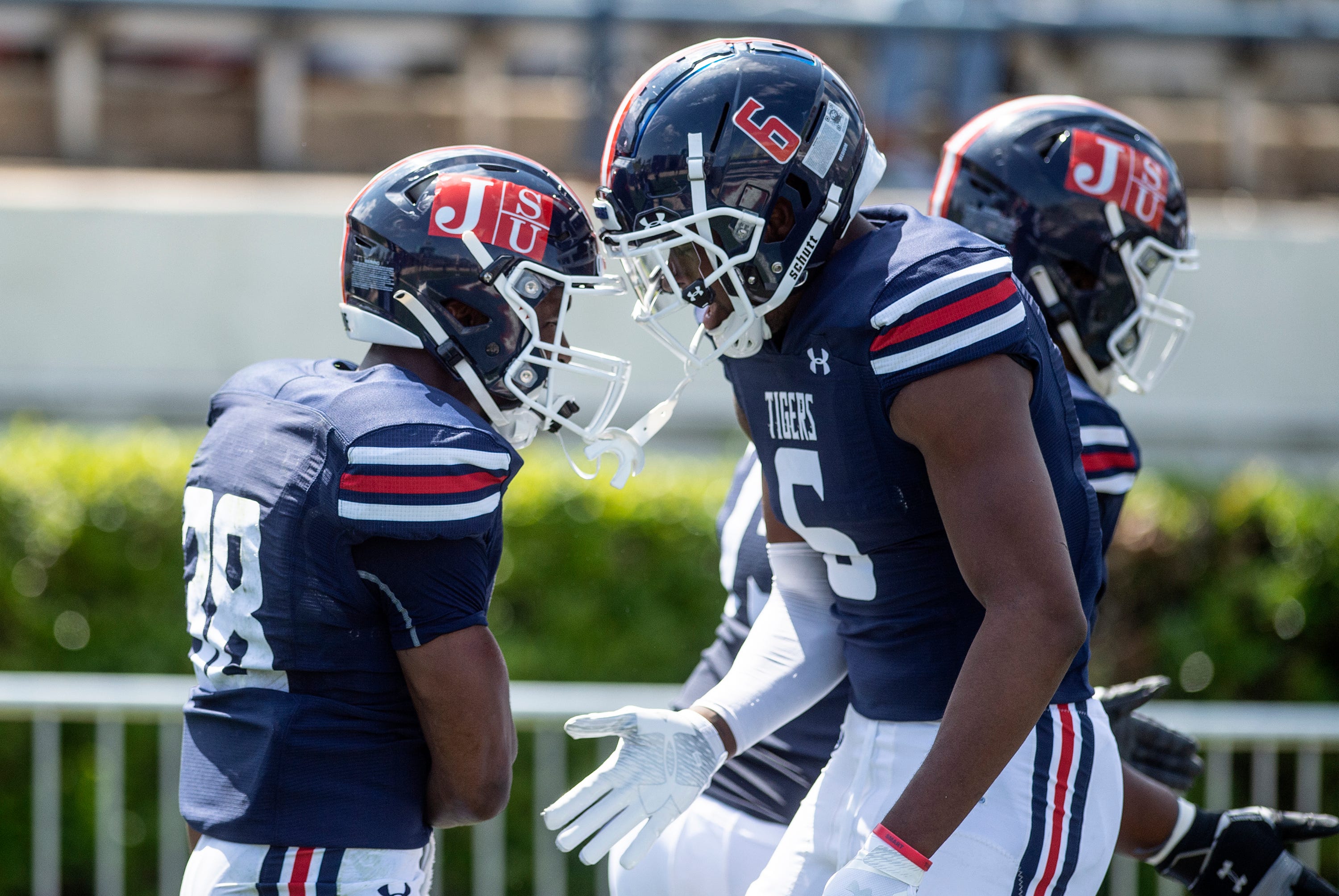 Jackson State University's Santee Marshall, left, celebrates with his team after he scored a touchdown against Alabama A&M during their game at Veterans Memorial Stadium in Jackson, Miss., Saturday, April 10, 2021.