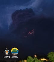 This handout image courtesy of the University of the West Indies (UWI) Seismic Research Centre released on April 9, 2021, shows lightning in the ash column during the eruption of La Soufriere Volcano from Rillan Hill in Saint Vincent.