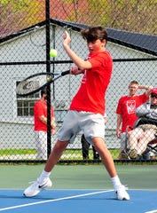 Shelby High School's Ty Keinath plays first doubles at the Ashland Invitational Saturday at Brookside Park.