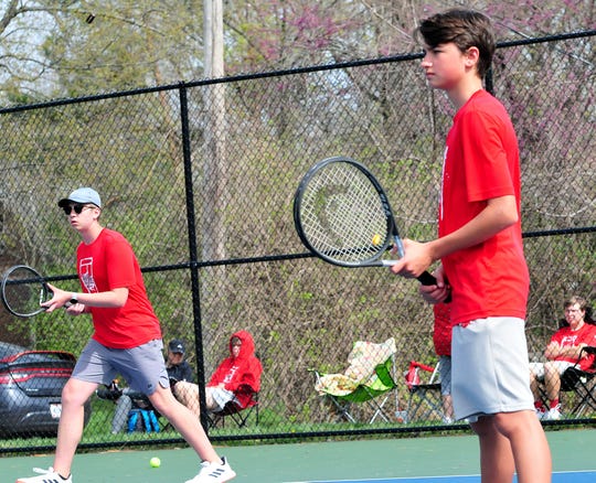 Shelby High School's Ty Cox, left, and Ty Keinath, right, wait for the serve from Ashland at the Ashland Invitational Saturday at Brookside Park.