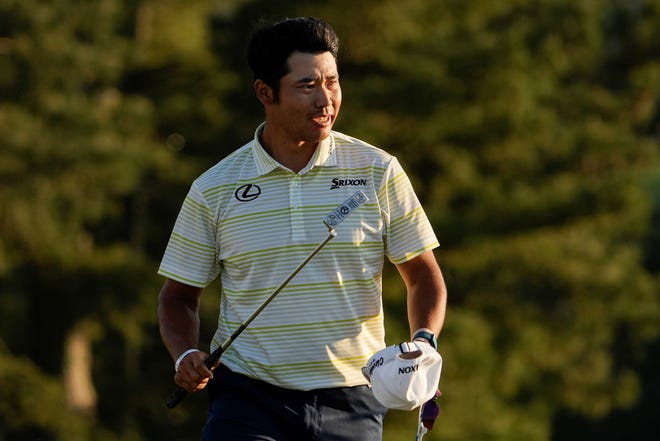 Hideki Matsuyama, of Japan, reacts after winning the Masters golf tournament on Sunday, April 11, 2021, in Augusta, Ga. (AP Photo/David J. Phillip)