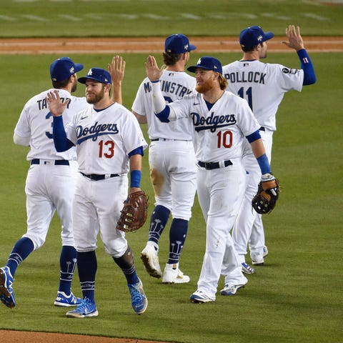 The Los Angeles Dodgers celebrate their 9-5 win ag