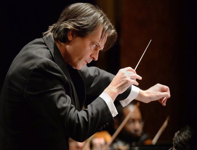 Erie Philharmonic conductor Daniel Meyer leads the orchestra during a performance inside the Warner Theatre on Jan. 18, 2020, in Erie. The Erie Philharmonic's "Come Home for the Holidays" shows are scheduled for Dec. 4 at Erie Insurance Arena.