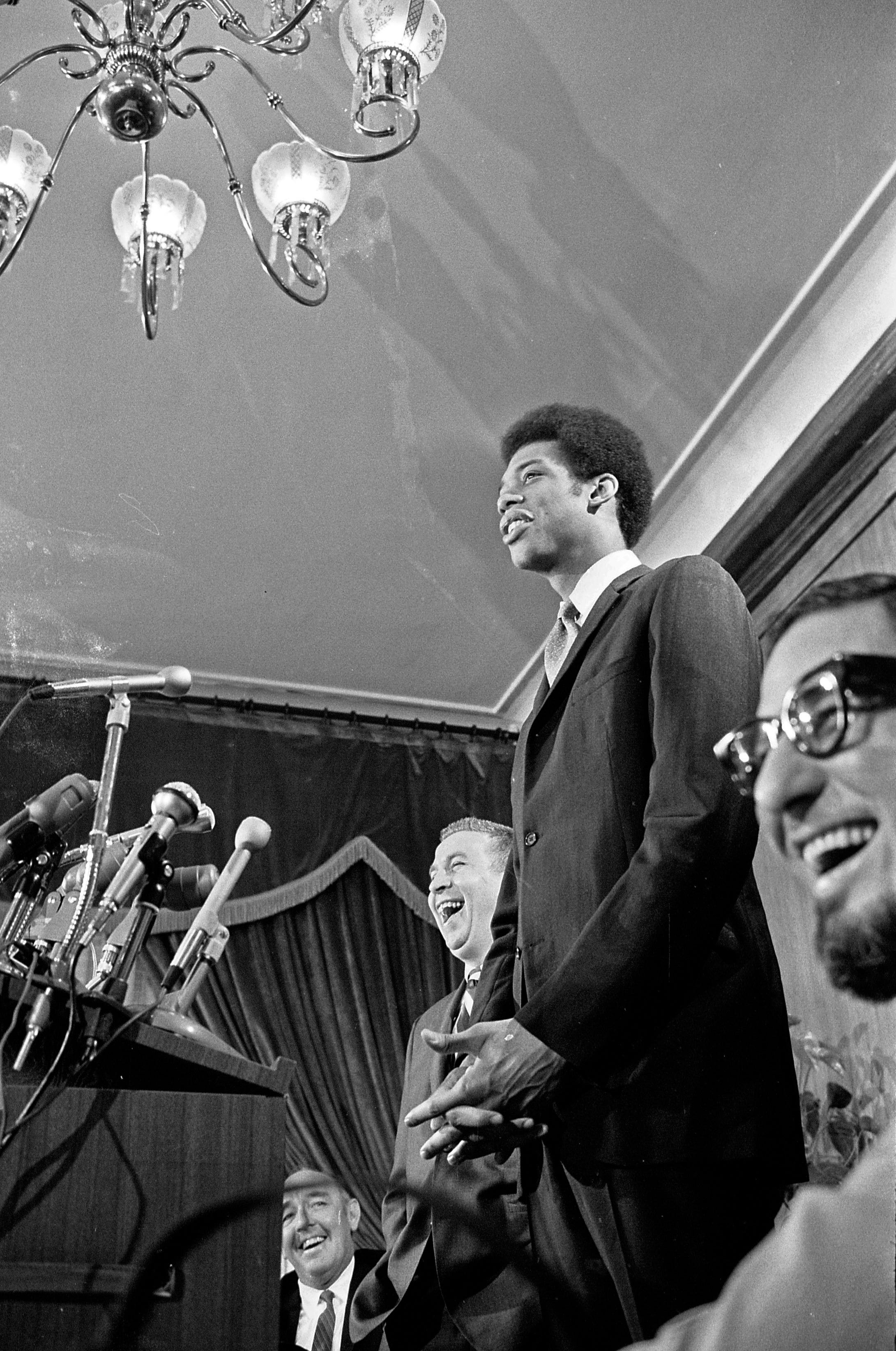 Lew Alcindor (who later changed his name to Kareem Abdul-Jabbar) waits to be introduced by the Milwaukee Bucks during a news conference at the Pfister Hotel in April 1969.