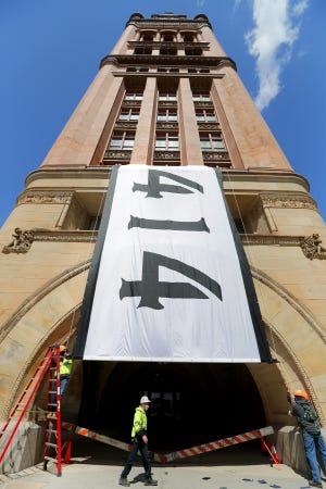 A giant 414 flag was unveiled from the balcony of Milwaukee City Hall on Monday, April 12, 2021. The 414 area code remains the hallmark of Milwaukee but Wisconsin has seen multiple area code changes over the years.