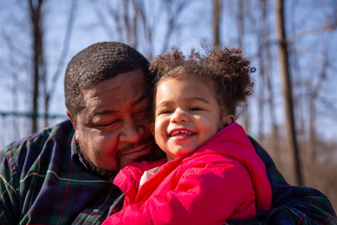 Robert Williams with his daughter Rosie. Williams was wrongfully arrested and jailed after he was mistakenly identified as a suspect in a theft investigation.