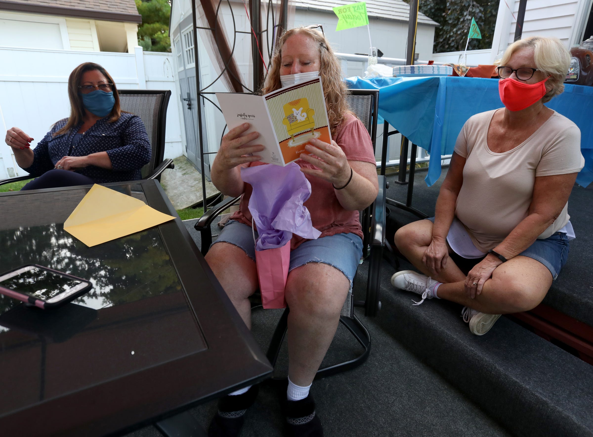 Edith Turner reads one of several cards from her friends at a party to celebrate her getting off parole in Pontiac, Mich., on Saturday, September 26, 2020.