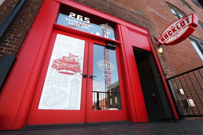 The red door entrance to Backlot Sandwich Shop off Front Street downtown Tuesday, April 13, 2021.