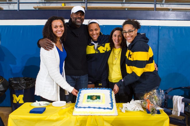 Molly Toon (center) celebrates Seniors Day at the University of Michigan in 2013, alongside her family (left), sister Kirby, father Al, mother Jane and sister Sydney.
